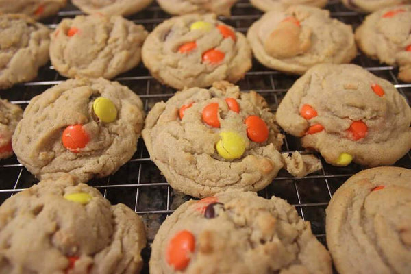 Combination peanut butter chip chocolate chip cookies with reese's pieces on top